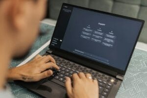 man using laptop, seo service in singapore